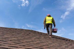 Roofer inspecting roof in South Salem, NY